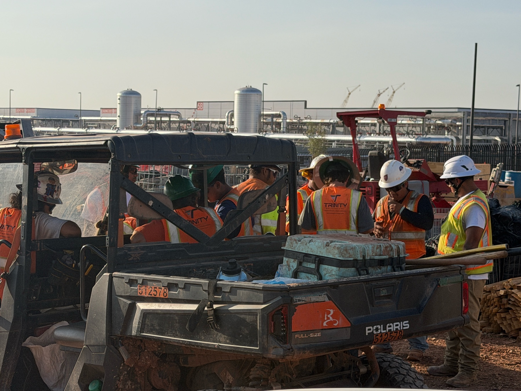 Trinity Environmental crew members gathered for field work at an active construction site